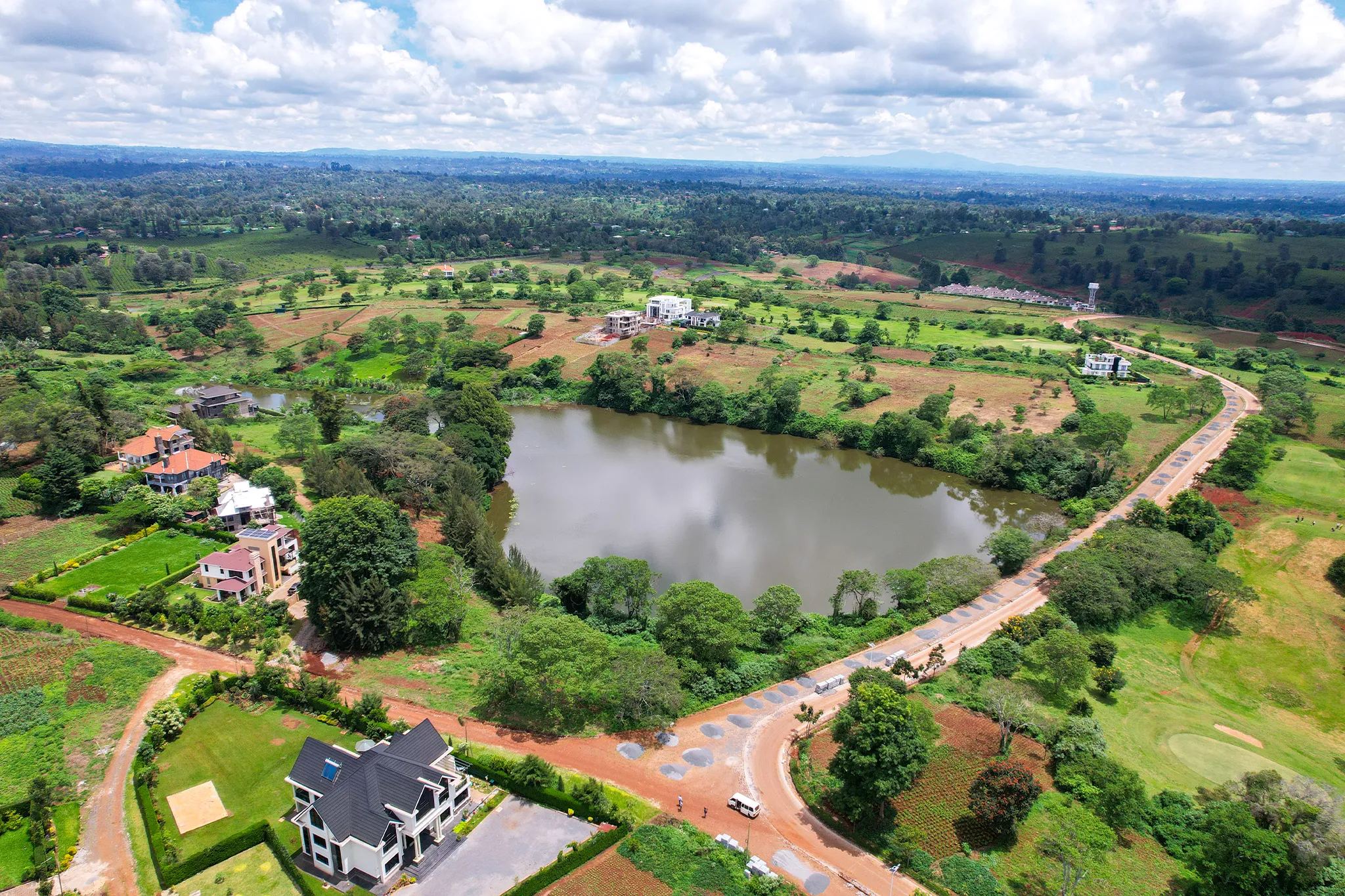 Natural dam and golf course surroundings aerial photography at Migaa Golf Estate