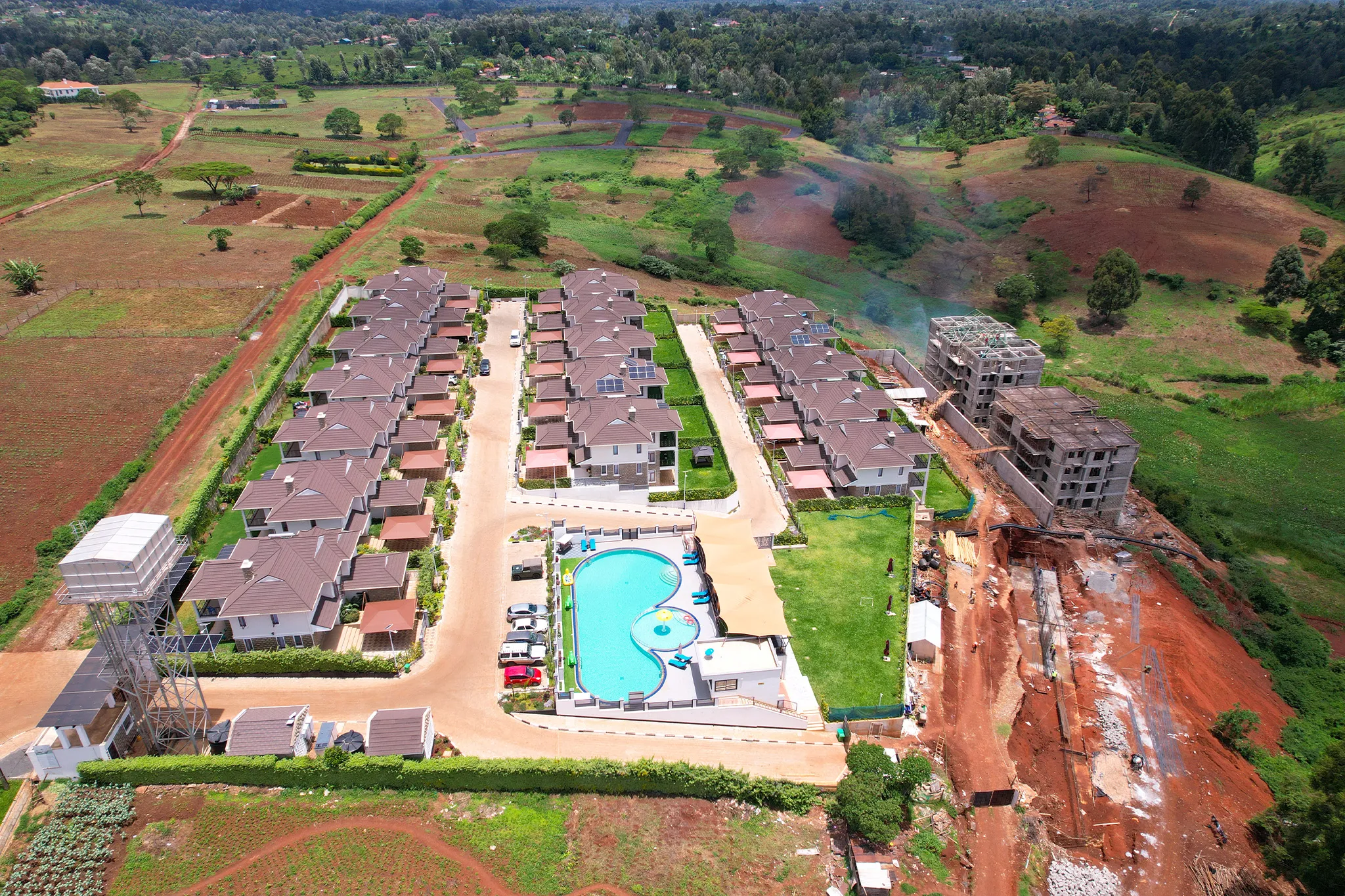 Migaa Golf Estate townhouse complex and ongoing construction — development progress aerial