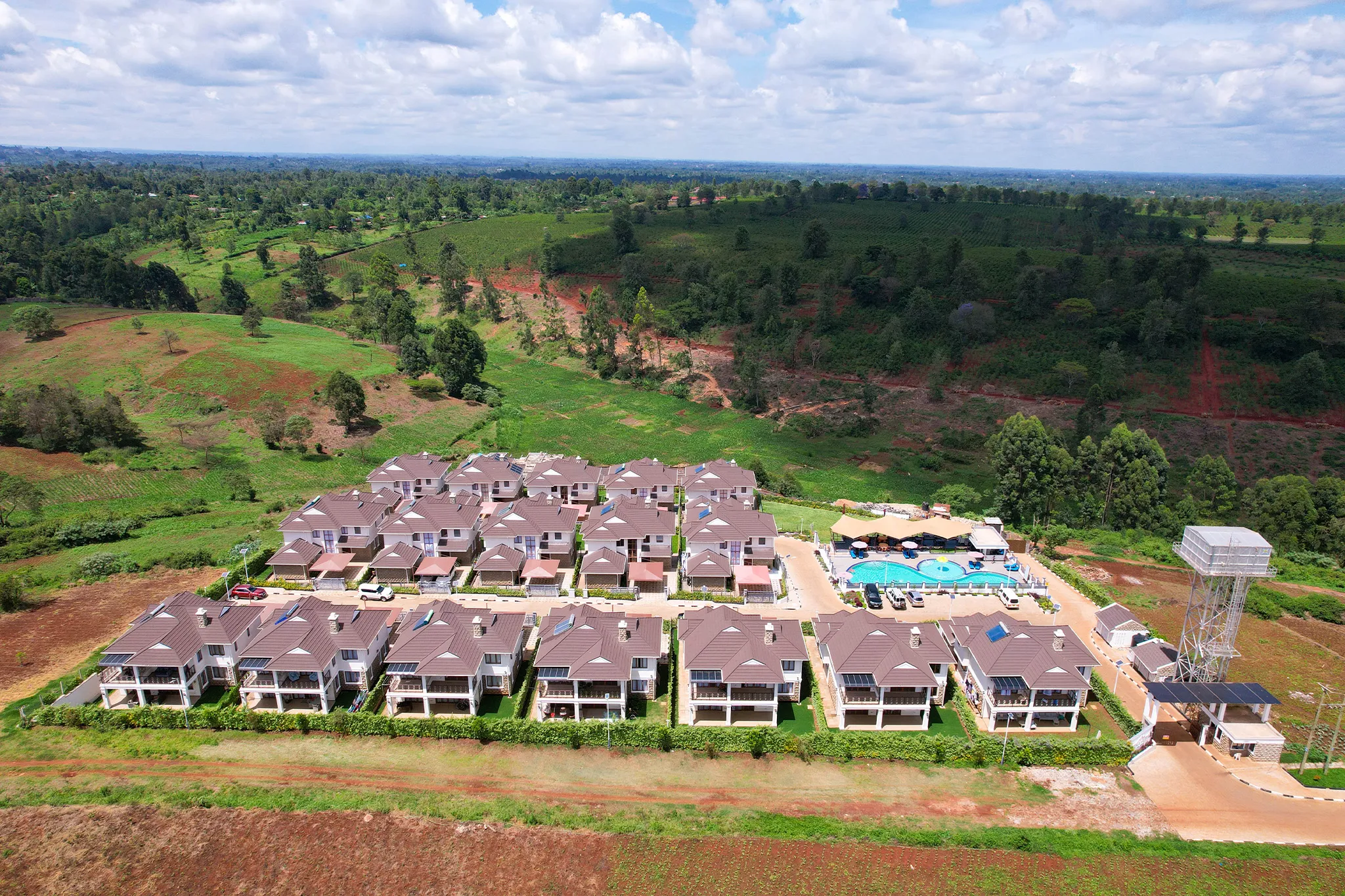 Migaa Golf Estate townhouse complex with swimming pool — aerial photography Kenya